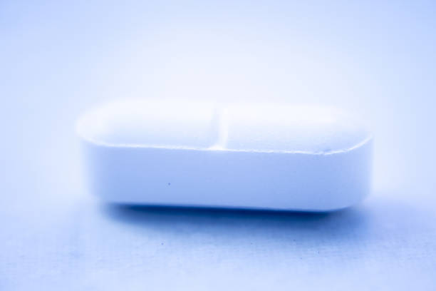 Prescription medication drugs photo. White tablet medicine pill isolated studio shot.
