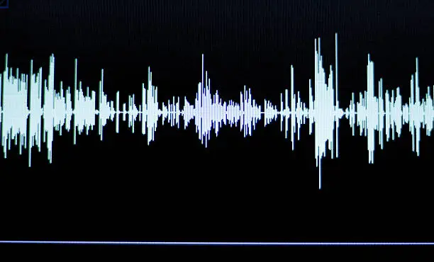 Audio studio digital voice recording voiceover sound wave on computer screen.