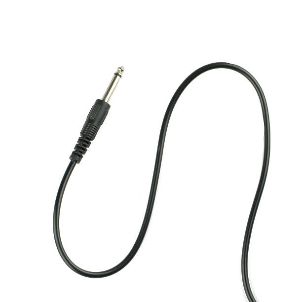 Guitar audio jack with black cable isolated on white background stock photo