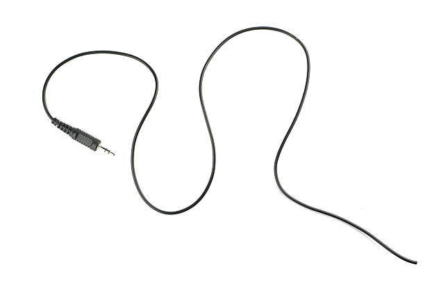 istock Guitar audio jack with black cable isolated on white background 503812316