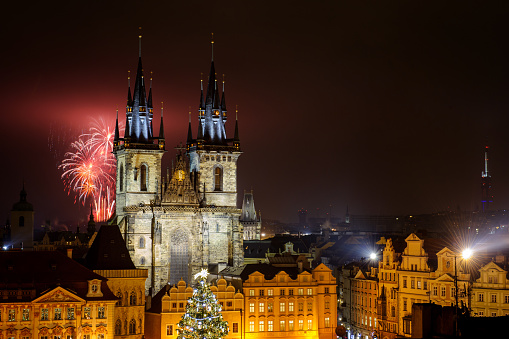 Prague old town with fireworks behind Church of Our Lady before Tyn  in the night with old building. Capital city of Czech Republic and one of the most famous tourist place in Europe.