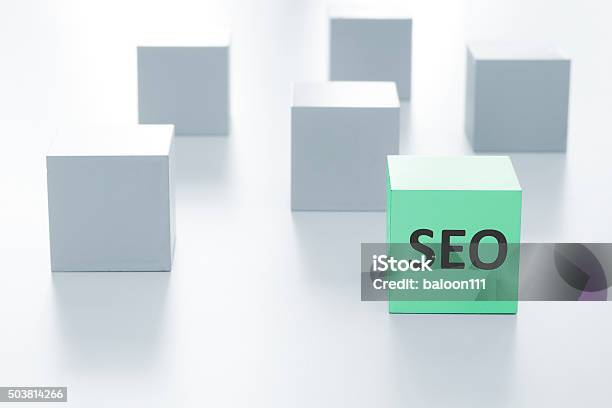 Green Cube With Seo Sign On A White Background Stock Photo - Download Image Now - Block Shape, Box - Container, Business Finance and Industry