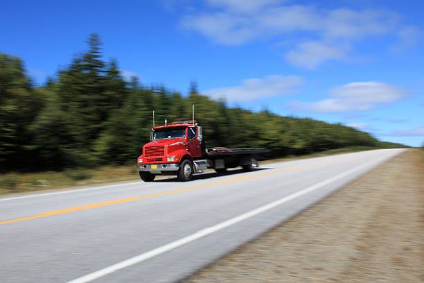 istock Tow Truck being driven on a highway 503816076