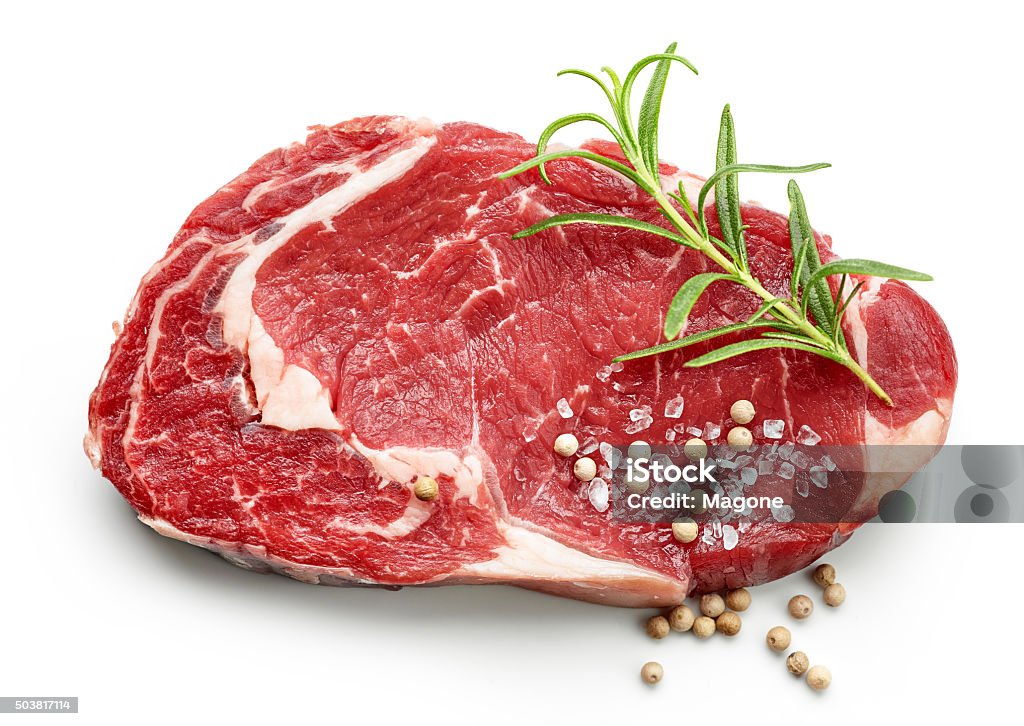 fresh raw beef steak with spices fresh raw beef steak with spices isolated on white background, top view Meat Stock Photo