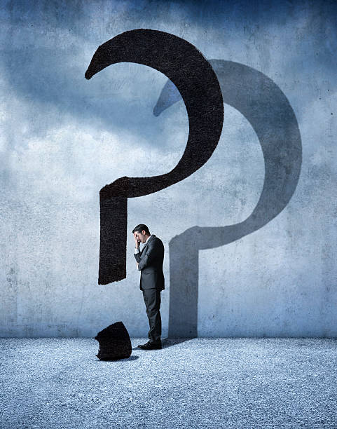 istock Businessman Standing In Shadow Of Question Mark 503817408