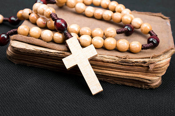 istock rosary and prayer book on a dark background 503818700
