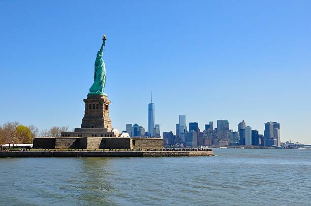 istock Back view of liberty statue with Manhattan in the background 503818922