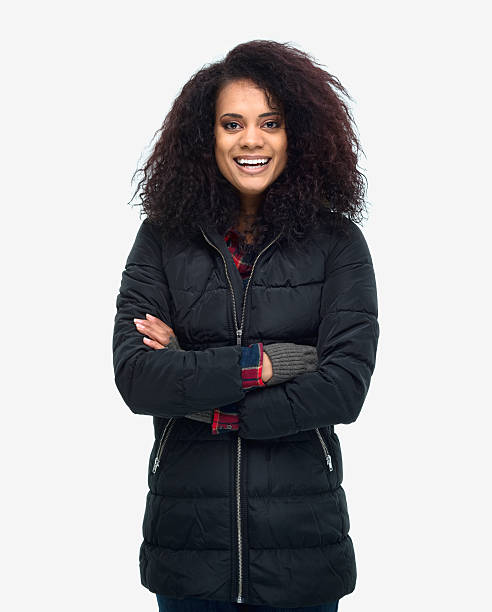 istock Smiling woman standing with arms crossed 503819040