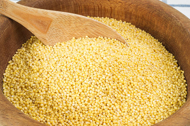 istock millet in a wooden bowl 503836007