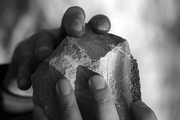 istock the hands of a man with a stone 503836185