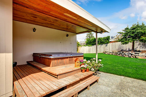 istock House exterior. Backyard deck with hot tub 503836717