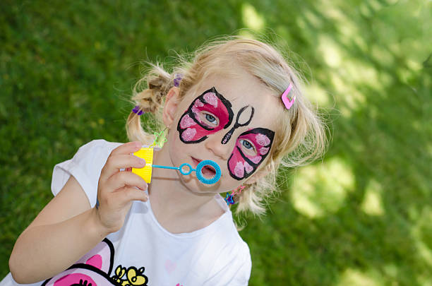 blond girl with face painting