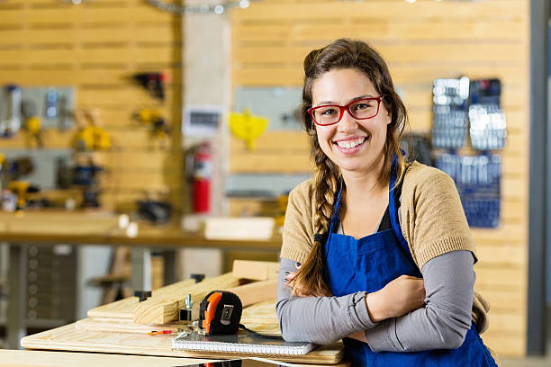 istock Young woman working in makerspace or carpentry shop 503838594