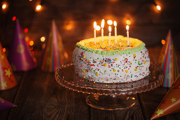 istock birthday cake on wooden table on light background 503840334