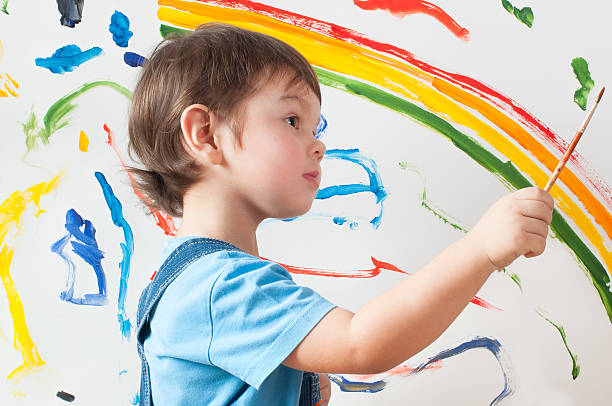 istock child draws ink on paper 503840416