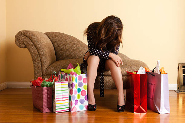 Tired woman resting after a shopping spree stock photo