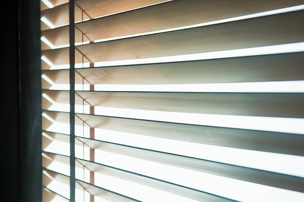 istock sunshine coming through venetian blinds 503841754