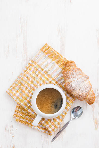 istock espresso and fresh croissant 503844516