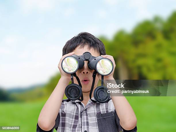 Boy Looking Birds By Binoculars Stock Photo - Download Image Now - Binoculars, Child, Boys