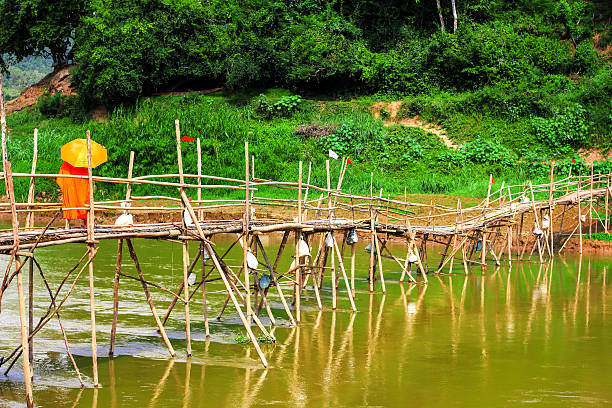 istock Monk walk on the wooden bridge 503846676
