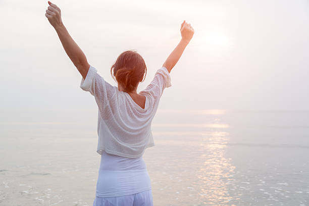 istock Happy woman on beach 503848864