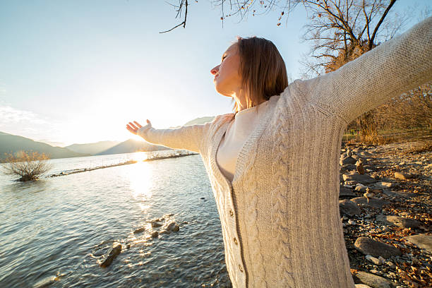 istock Cheering woman at sunrise 503849202