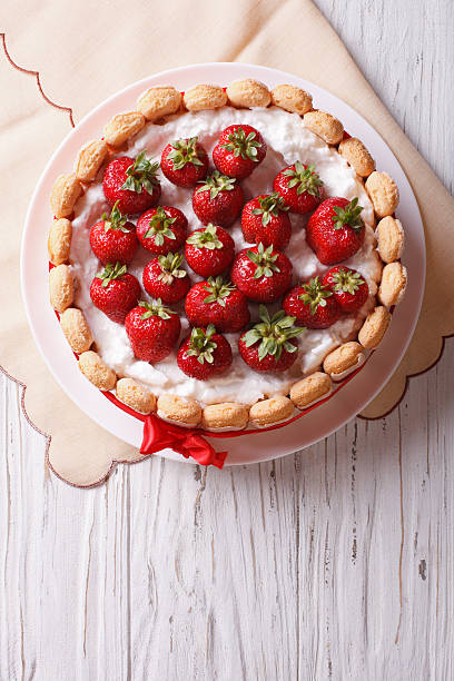 istock French Fresh Strawberry charlotte cake. vertical top view 503849414