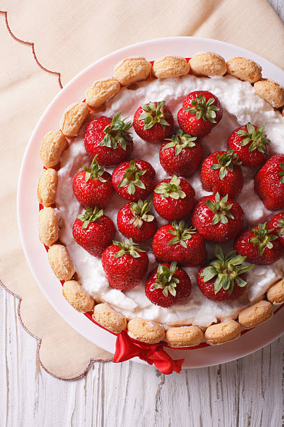 istock French Strawberry charlotte closeup on the table. vertical top v 503849660
