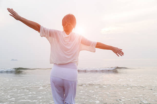 istock Happy woman on beach 503860278