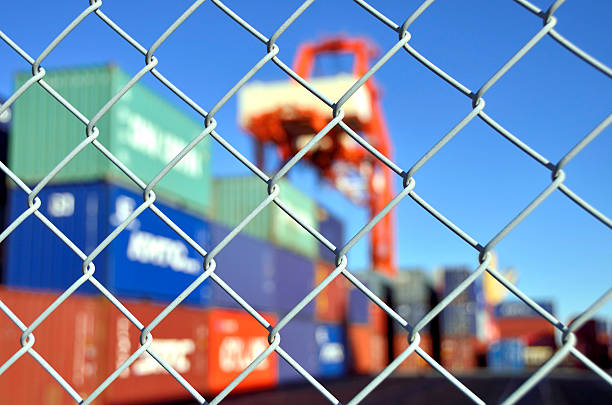 container yard security fence container yard security fence international border stock pictures, royalty-free photos & images