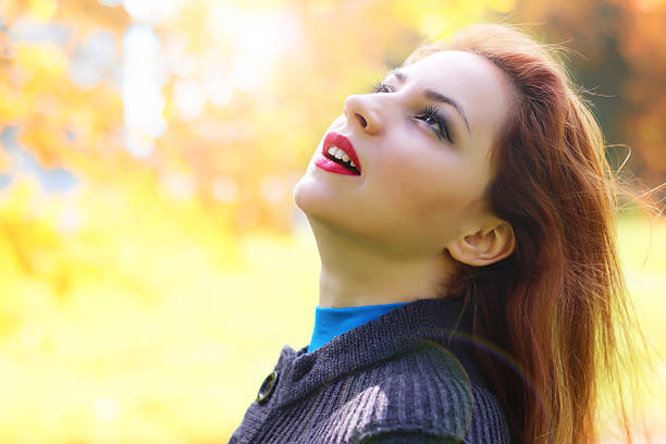 istock Girl autumn leaves coat 503862970