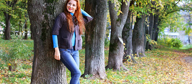 istock Girl autumn leaves coat 503862992