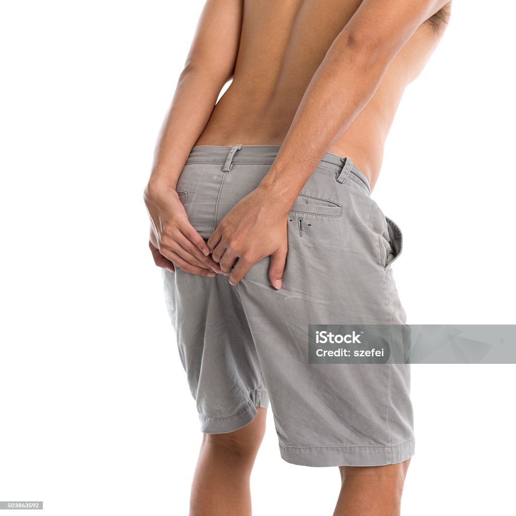 Man having diarrhea Man holding his butt and having diarrhea, isolated on white background. 2015 Stock Photo