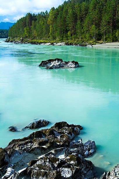 istock Stony bottom of the turquoise river 503863772