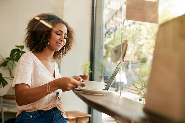 istock Young african girl having coffee at cafe 503865502