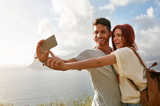 istock Happy couple making selfie with smart phone 503865834