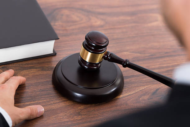 istock Judge Hitting Mallet At Desk 503865914