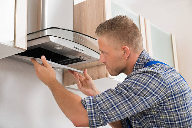 istock Repairman Repairing Kitchen Extractor Filter 503866566
