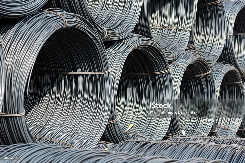 Pile of wire rod or coil for industrial usage A pile of wire rod or coil as a raw material for industrial usage Cable Stock Photo
