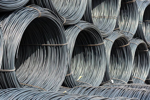 Pile of wire rod or coil for industrial usage A pile of wire rod or coil as a raw material for industrial usage iron metal stock pictures, royalty-free photos & images
