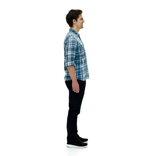 istock Smiling man standing and looking away 503867318