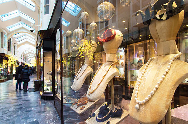 Woman standing in front of a shop window in the Grand Bazaar (Kapalı Çarşı) in Istanbul, Turkey, admiring the jewelry and exploring the vibrant market atmosphere.