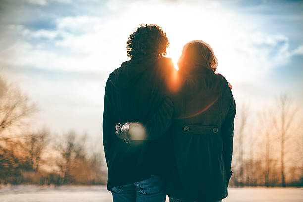 istock Couple in love in a snowy park 503867728