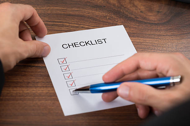 istock Person's Hand Filling Checklist 503867752
