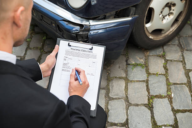 istock Man Filing Insurance Claim Form 503867980