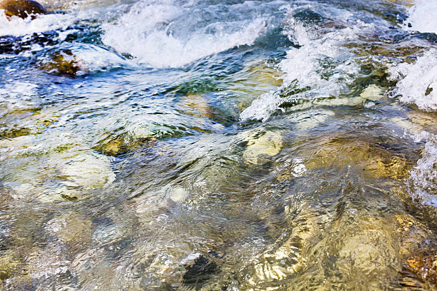 istock Close up of waterfall stream during high water flow Background 503868184