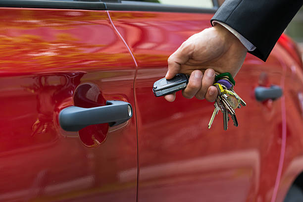 istock Man Opening The Car Door With Remote Control 503868286