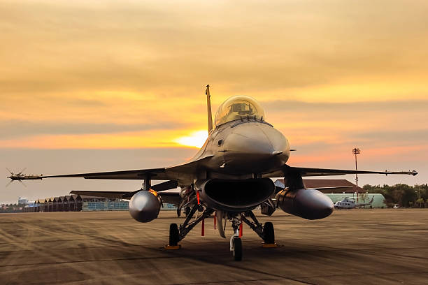 istock f16 falcon fighter jet on sunset 503868734