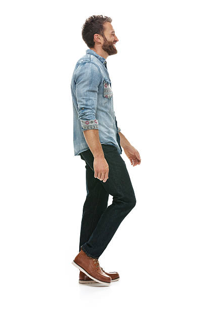 istock Smiling man walking and looking away 503868922