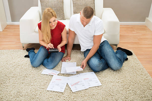 istock Couple Calculating Bills 503869620